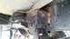 1988 Ford Bronco - Custom suspension mount fabricated onto the vehicle frame with visible welding and bolts.
