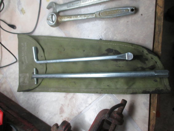 Toyota Motor Made in Japan tool pouch with lug wrench and tire iron, plus a separate ratchet and wrench