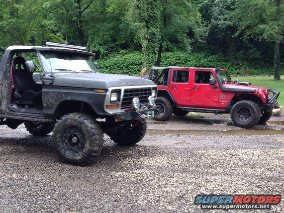 Black 1978 Ford Bronco with lifted suspension and off-road tires, doors removed