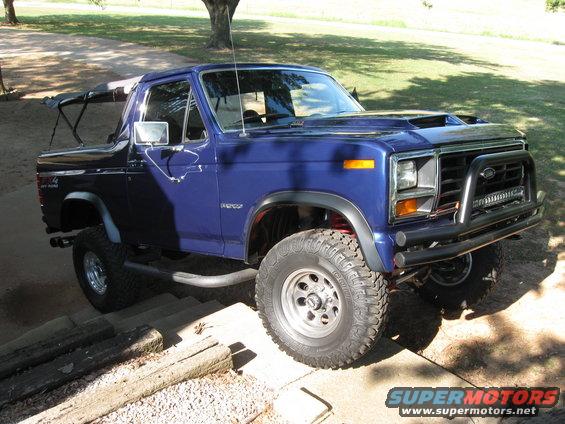 Blue 1982 Ford Bronco 3/4 front view with aftermarket bumper and hood scoop