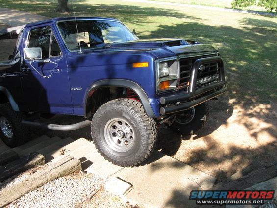 1982 Ford Bronco, blue, with aftermarket bull bar and LED light bar