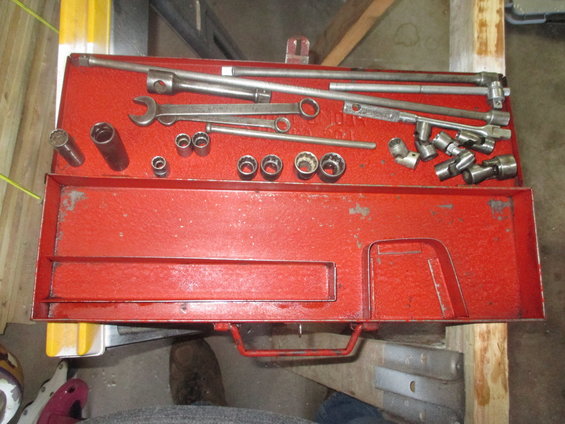 Red tool chest filled with sockets and wrenches