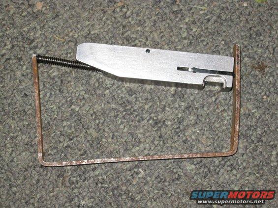 Metal part with spring and wire frame