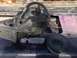 1979 Ford Bronco - A disassembled power steering pump assembly is shown resting on the vehicle's frame.