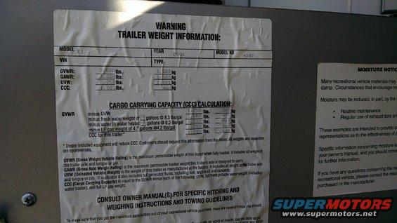 Trailer weight information sticker with GVWR, GAWR, UVW, CCC, and moisture notice