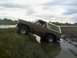 1980 Ford Bronco - This 1980 Ford Bronco is navigating a muddy terrain with water.
