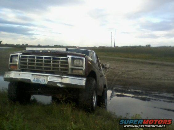 1978 Ford Bronco front view stuck in mud with light bar on roof