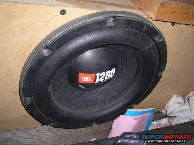 JBL 1200 subwoofer mounted in a wooden enclosure