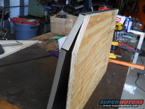 Metal trim attached to a plywood structure on a workbench