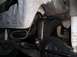 1990 Ford F-150 - Close-up of the vehicle's undercarriage, showing steering and suspension components with signs of wear and grease.