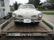 1969 Volkswagen Karmann Ghia - A classic Volkswagen Karmann Ghia is loaded onto a trailer, ready for transport.