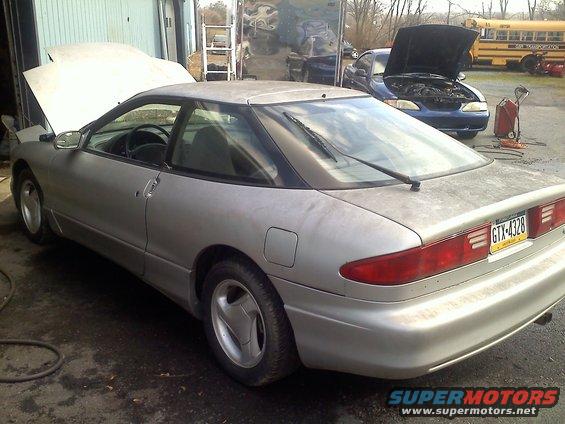 Silver 1993 Ford Probe GT with hood open, rear quarter view