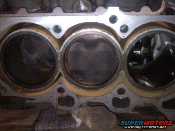 Engine block with pistons visible