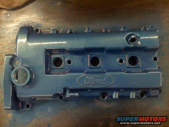Blue painted Ford valve cover with embossed Ford logo