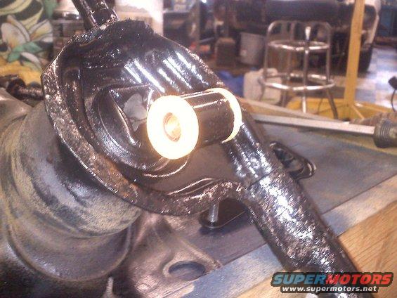 Suspension part with white bushing