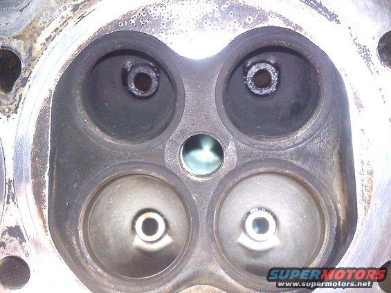 Engine cylinder head with four valve openings, two intake and two exhaust