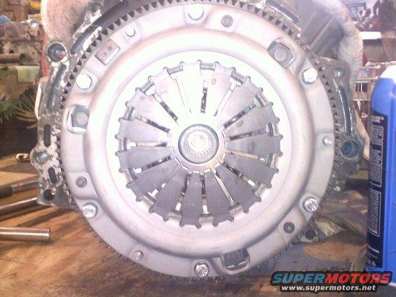 Clutch assembly with flywheel and pressure plate visible