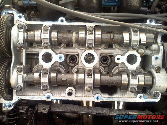 Engine valve train with camshafts and valves visible