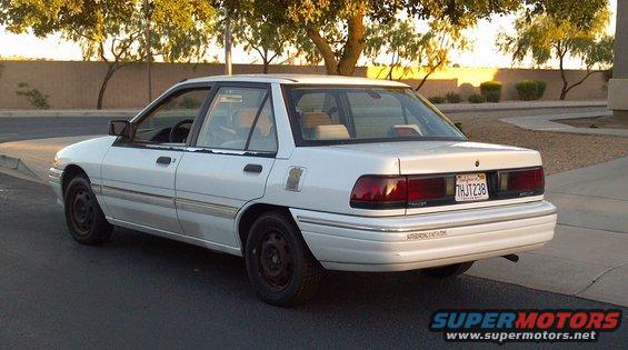 1993 Mercury Tracer sedan, rear 3/4 view. License plate THJ238