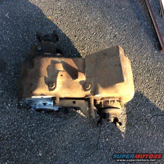 Rusty transfer case on asphalt