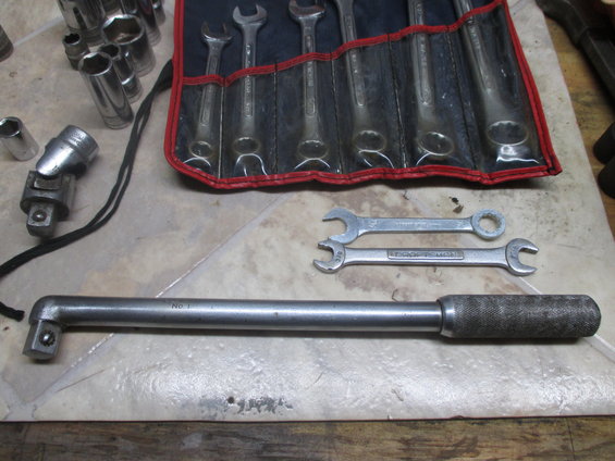 Tool kit with wrenches, sockets, and a breaker bar. Text 'No. 1' visible