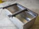 1992 Ford Bronco - Custom metal tanks are being fabricated with a steel frame structure in a workshop.