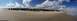 1979 Ford Bronco - A group of off-road vehicles gathered on a sandy beach under a partly cloudy sky.