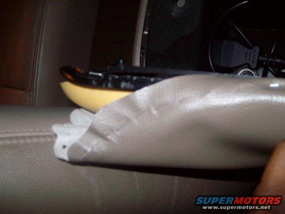 Car interior shot showing a yellow and black object, possibly a dash trim piece, and a USB adapter plugged into a port