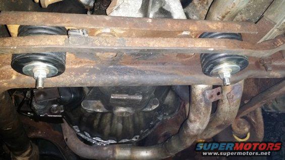 Underbody view of vehicle suspension mounts and exhaust system