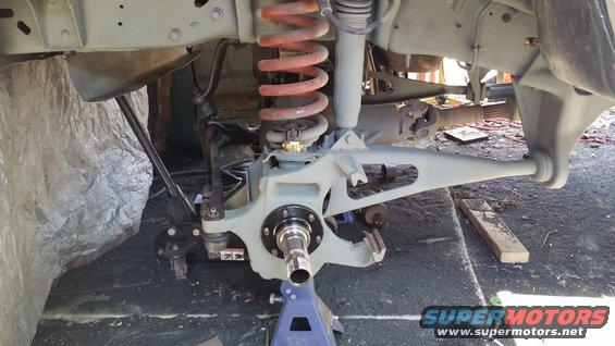 Front suspension and hub assembly with orange coil spring