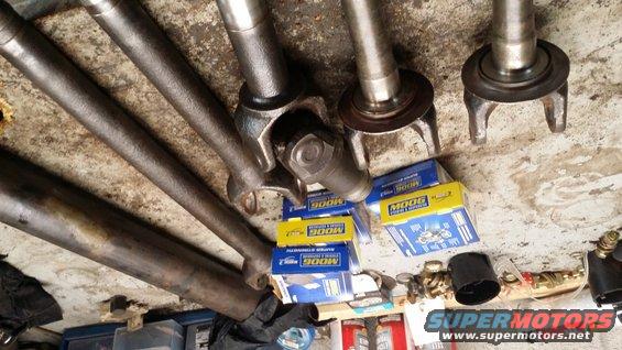 Driveshafts and Moog U-joint boxes on a concrete floor
