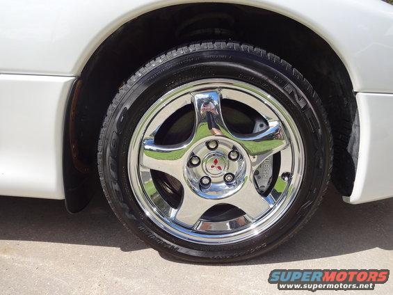 1995 Mitsubishi 3000GT wheel with chrome five-spoke rim and Mitsubishi logo