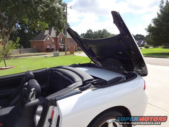 White convertible rear view with hood open