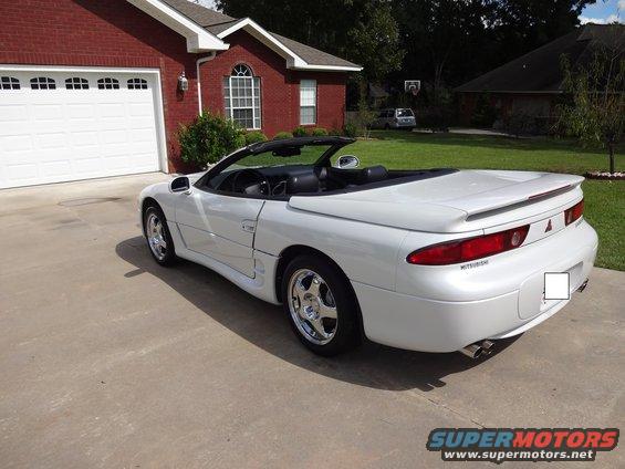 White 1995 Mitsubishi 3000GT convertible parked in driveway