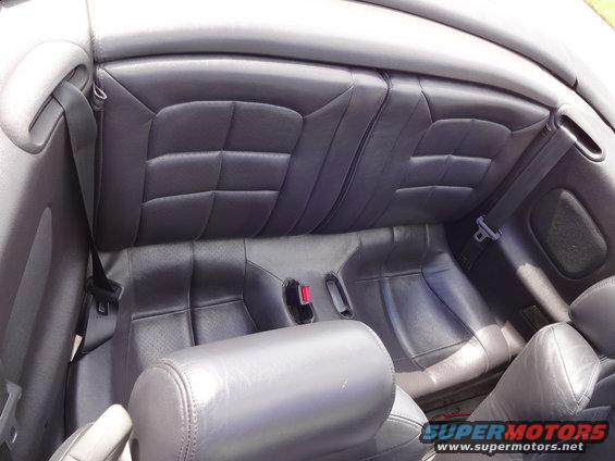 Black leather rear seats with quilted pattern and seatbelts