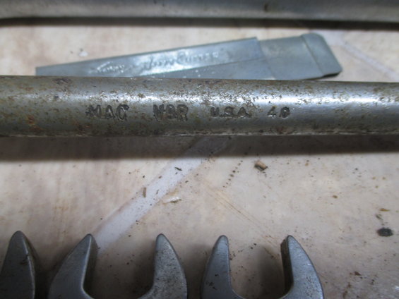 MAC N9R USA 40 stamped on a metal tool handle, with several wrench heads visible below
