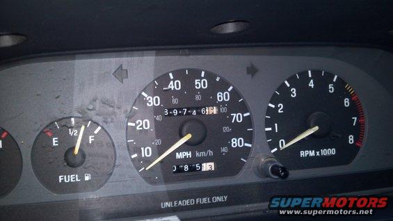 Dashboard gauges with fuel, speedometer, and tachometer. Speedometer reads 30 MPH