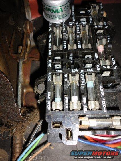 Turn signal flasher wiring transferred to fuse panel lower left corner because the replacement 552 flasher will not mount in the original under dash location (purple wire in horizontal slot and blue wire in vertical slot)