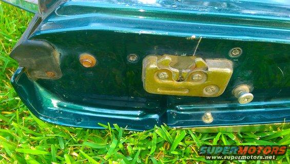 Green tailgate latch mechanism with Supermotors.net logo