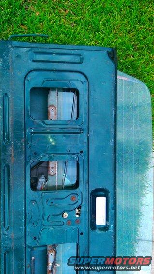 Teal tailgate interior with window and Supermotors logo