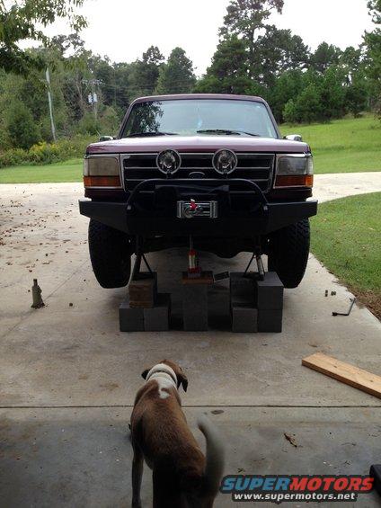 1996 Ford Bronco front view, raised on blocks with aftermarket bumper and winch
