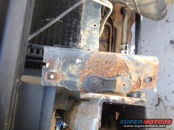 rusted metal bracket near radiator