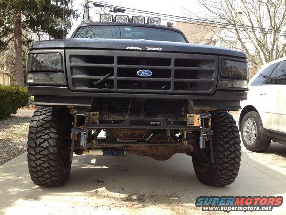 Black Ford Bronco with aftermarket winch bumper and large tires