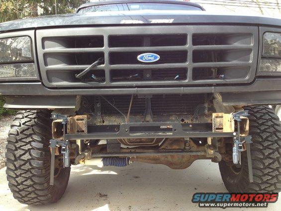 1996 Ford Bronco front grille with Ford logo, custom winch bumper, and large off-road tires