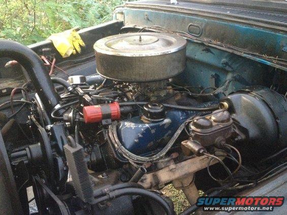 1971 Ford F-250 engine bay with blue valve covers and a large air cleaner