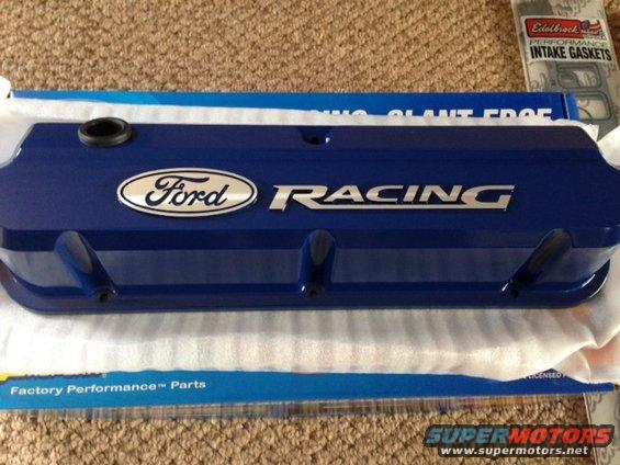 Blue Ford Racing valve cover with Ford oval logo. Edelbrock intake gaskets also visible