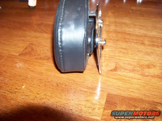 Black leather steering wheel hub adapter on wooden surface