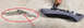 1993 Ford Bronco - A metal bracket and a car's interior trim piece are shown on a concrete surface.