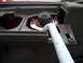 1993 Mazda MX-3 - Close-up view of a white strut bar installed in the interior of a red vehicle.