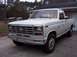 1985 Ford F-250 - This white Ford F-250 pickup truck from the early 1980s is shown in a front 3/4 view.